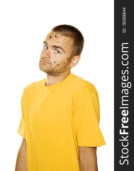Handsome young man, his face and hands stained the ground. The guy shrugs. Isolated on a white background. Handsome young man, his face and hands stained the ground. The guy shrugs. Isolated on a white background