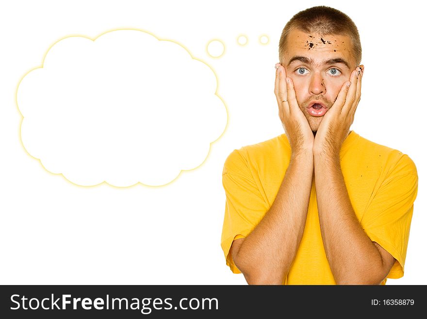 Handsome young man, his face and hands stained the ground. Face guy expresses shock, his hands are on her cheeks. Isolated on a white background