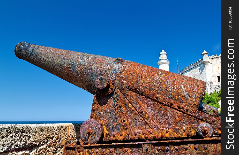 An old rusty cannon in the castle of El Morro in Havana, Cuba on a beautiful summer day