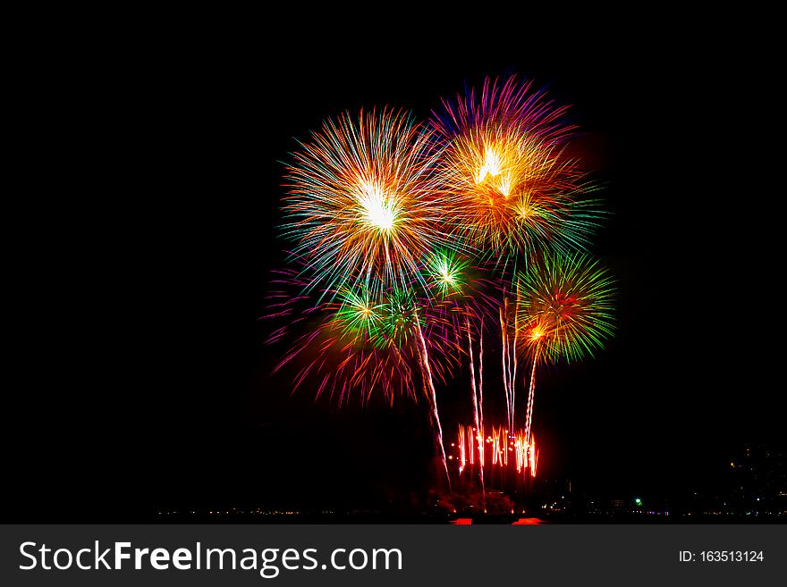 Beautiful Colorful Fireworks Display On The Sea Beach, Amazing Holiday Fireworks Party.