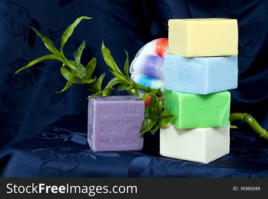 Composition with natural soap on a blue background. Composition with natural soap on a blue background