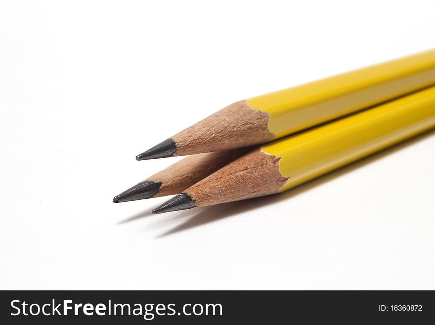 Close-up of three sharpened pencils