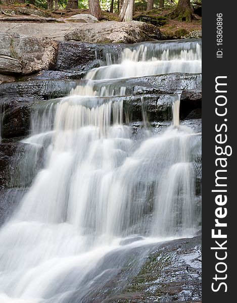 A small waterfall flows down the rocks in northern Ontario. A small waterfall flows down the rocks in northern Ontario.