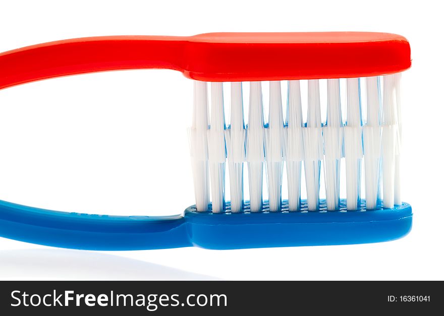 Blue and red toothbrushes isolated on a white background. Blue and red toothbrushes isolated on a white background