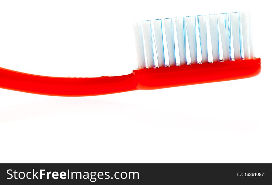 Red toothbrush isolated on a white background. Red toothbrush isolated on a white background