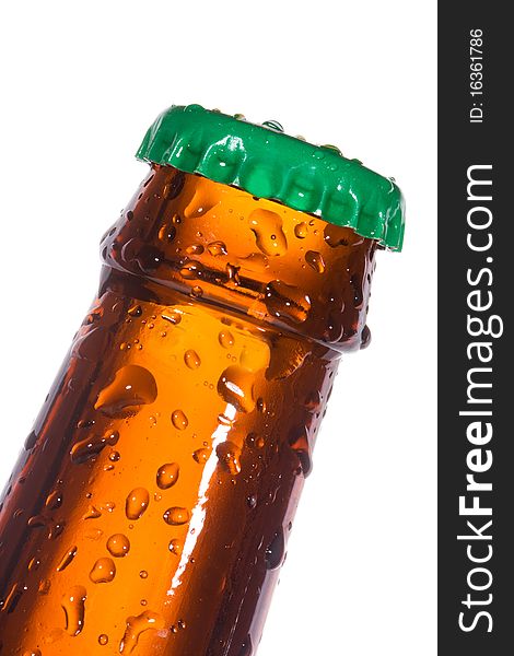 Bottle of beer with water drops on white background