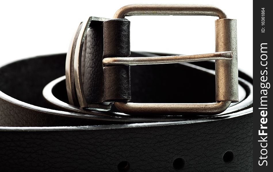 Close up view of a black leather belt on a white background