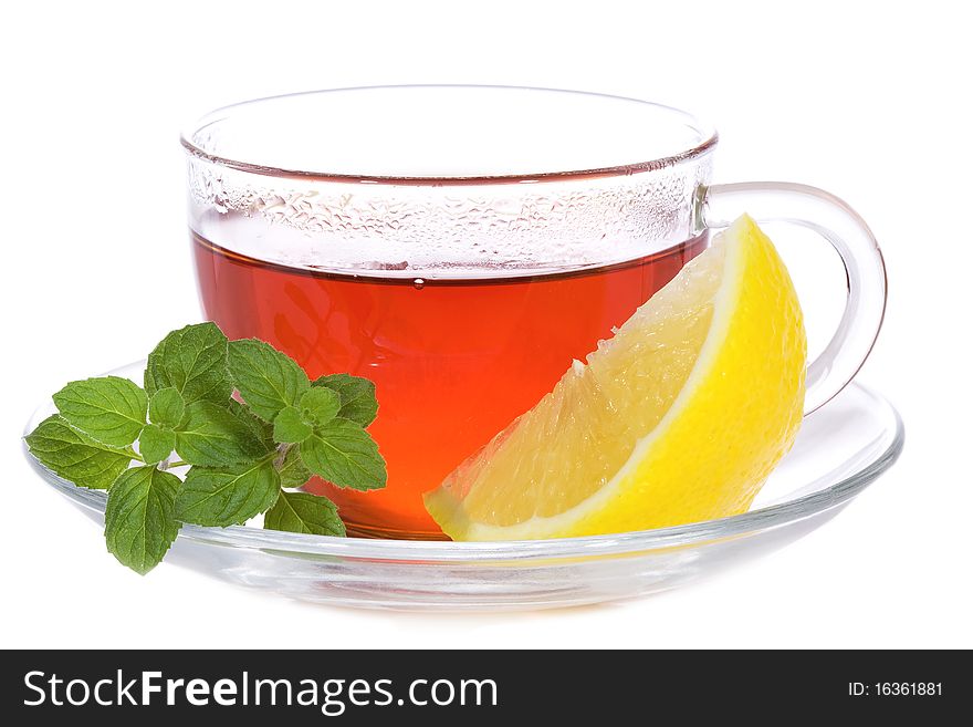 Tea with mint and lemon on white background