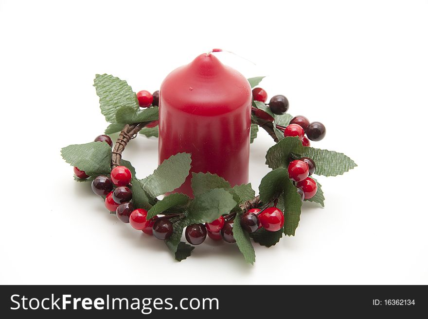 Wreath with berries and red candle. Wreath with berries and red candle