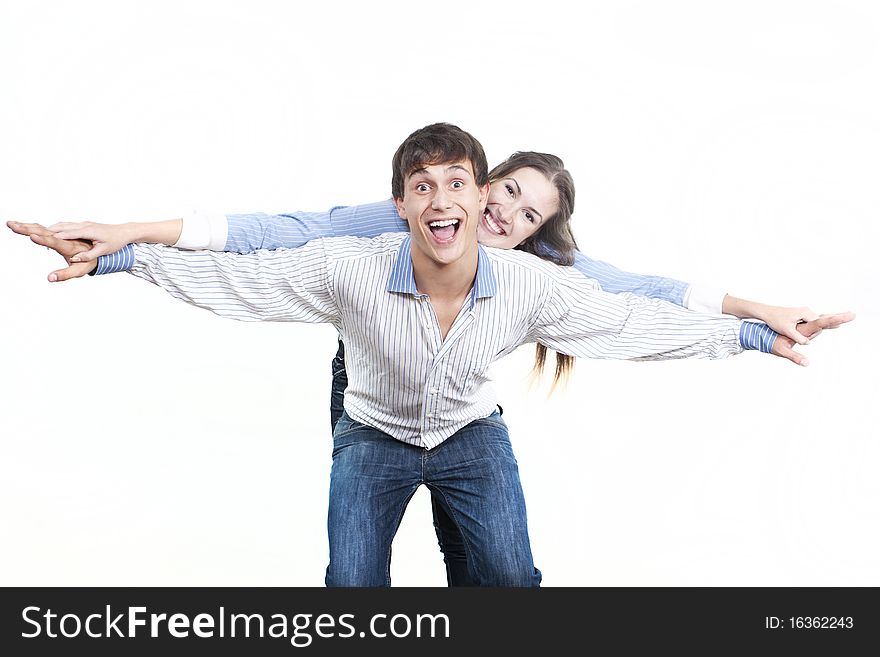 Two young happy person with the hands lifted upwards. Two young happy person with the hands lifted upwards