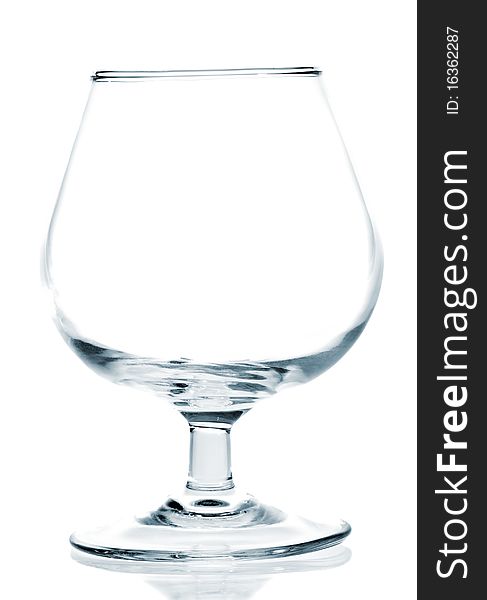 Empty wine glass on a white background with reflections on the floor