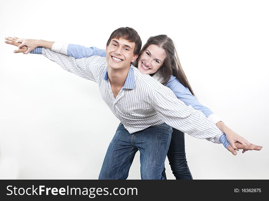 Two young happy person with the hands lifted upwards. Two young happy person with the hands lifted upwards