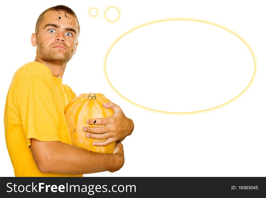 Young man squeezes with both hands a pumpkin face and hands stained the ground. Approximation of Halloween. Isolated on a white background