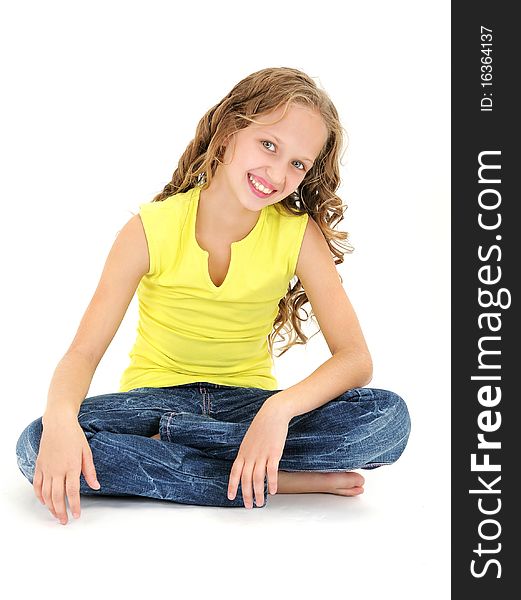 Beautiful 11 years old girl sitting on the floor and smiling. Beautiful 11 years old girl sitting on the floor and smiling