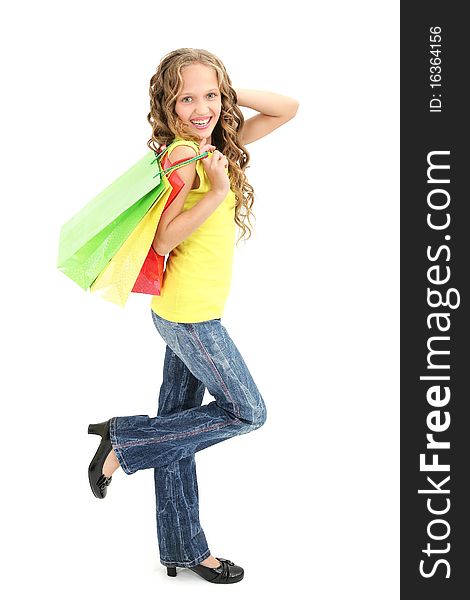 Beautiful 11 years old girl holding shopping bags and laughing. Beautiful 11 years old girl holding shopping bags and laughing
