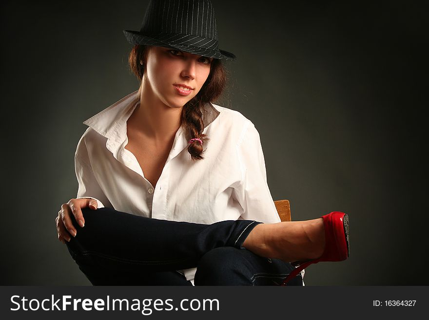 Retro-styled woman on chair. Retro-styled woman on chair
