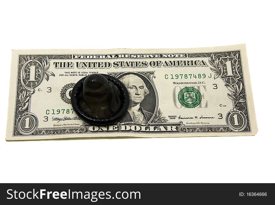 The open black condom lying on the American money. The open black condom lying on the American money