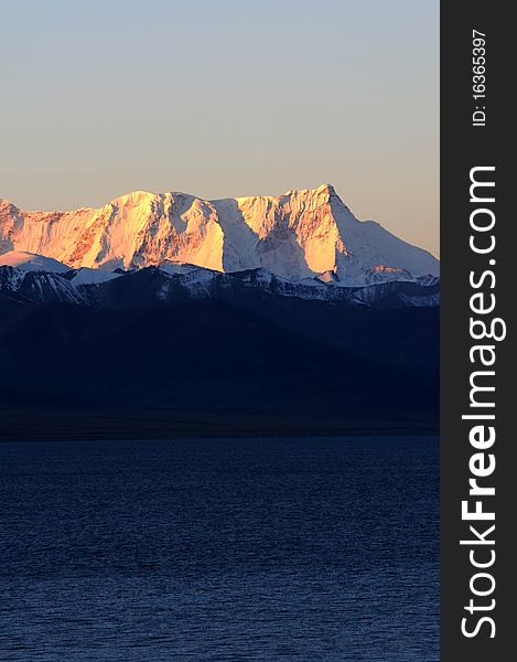 Scenery of snow mountains in Tibet at sunrise.