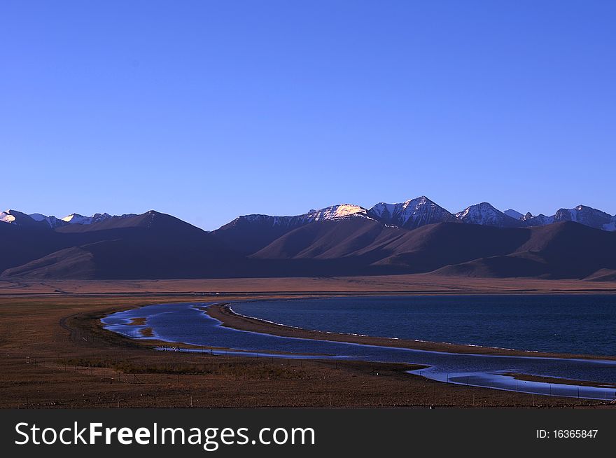 Scenery of lake and mountains at daybreak in Tibet. Scenery of lake and mountains at daybreak in Tibet.