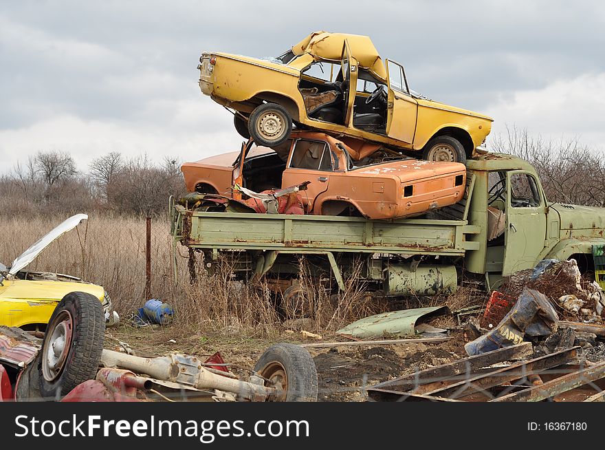 Truck and cars of each other in the scrap. Truck and cars of each other in the scrap