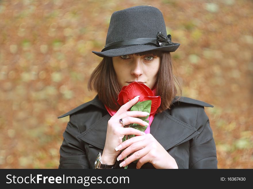 Girl In Hat With Red Rose