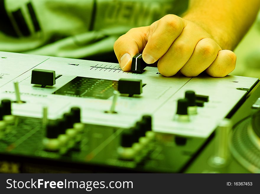 Hand Of A Dj Adjusting The Crossfader