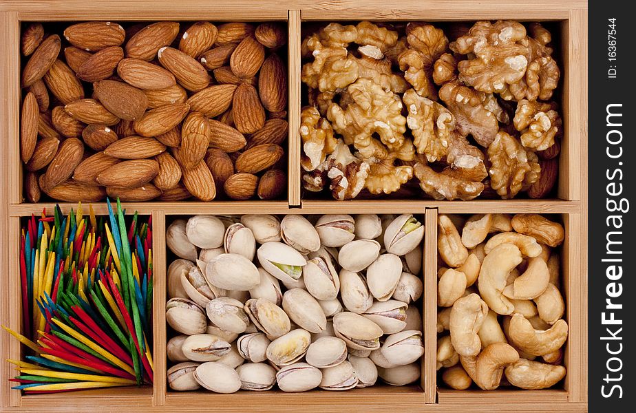 Nuts of different grades in a wooden box.