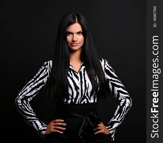 Young and sexy girl in pink blouse at black background. Young and sexy girl in pink blouse at black background