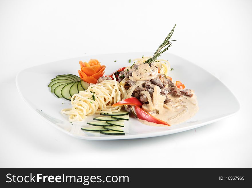 Mixed salad with mushrooms and vegetables on a white plate. Mixed salad with mushrooms and vegetables on a white plate