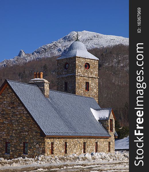 Quaint stone mountain church in snow in the scenic blue ridge mountains of western north carolina. Quaint stone mountain church in snow in the scenic blue ridge mountains of western north carolina