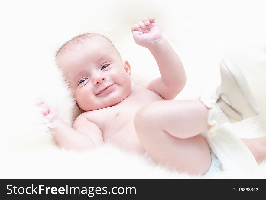 The small cheerful kid on a white background. The small cheerful kid on a white background