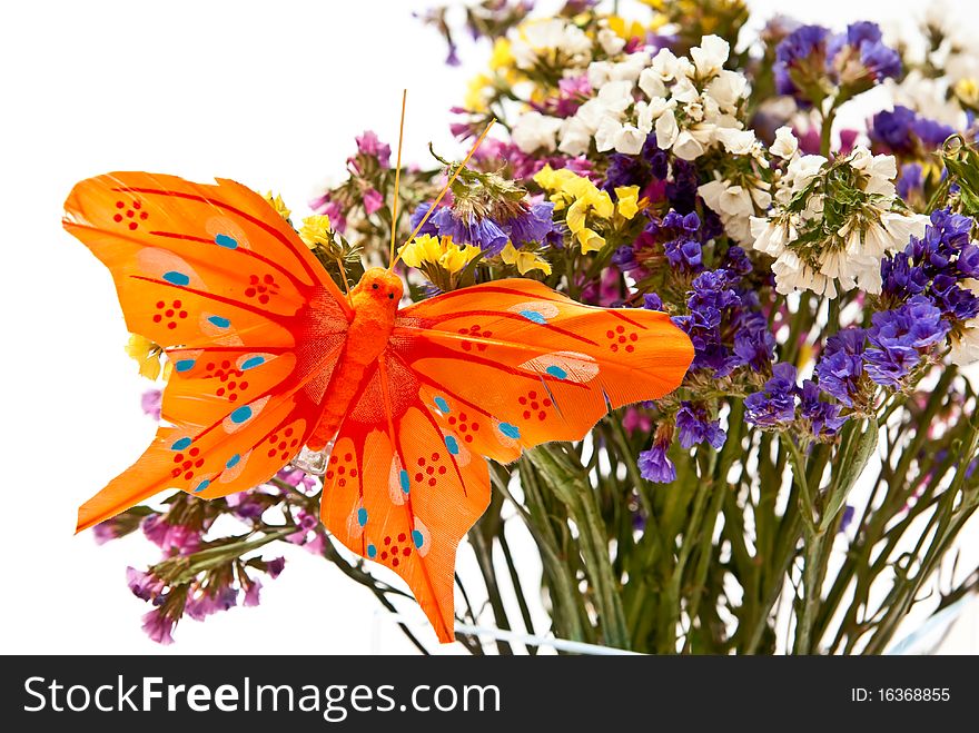 Flowers in glass vase with butterfly. Isolated on white. Flowers in glass vase with butterfly. Isolated on white