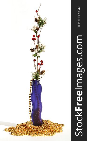 Christmas decoration in colored glass vase on white background