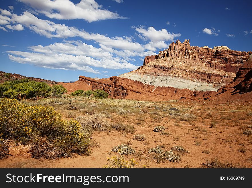 View of the red rock formations in Capitol Reef National Park with blue skyï¿½s and clouds