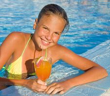 Cute Girl With A Cocktail At Pool Royalty Free Stock Image