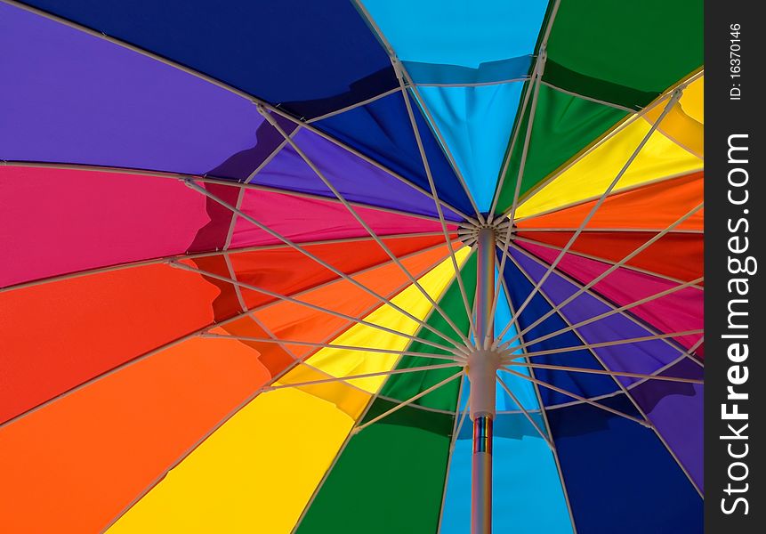 Closeup of a multi-colored beach umbrella viewed from underneath. Closeup of a multi-colored beach umbrella viewed from underneath