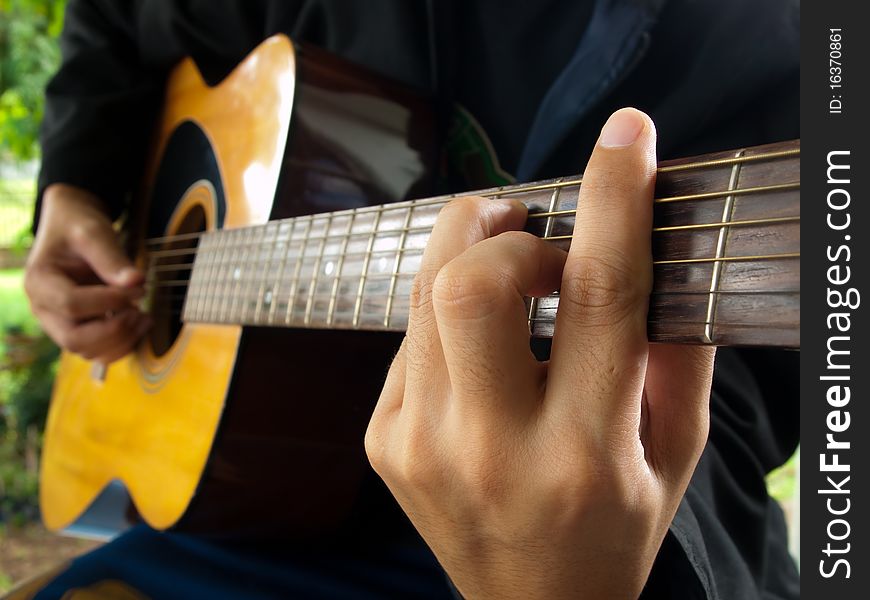 Man playing folk guitar ,in the mood