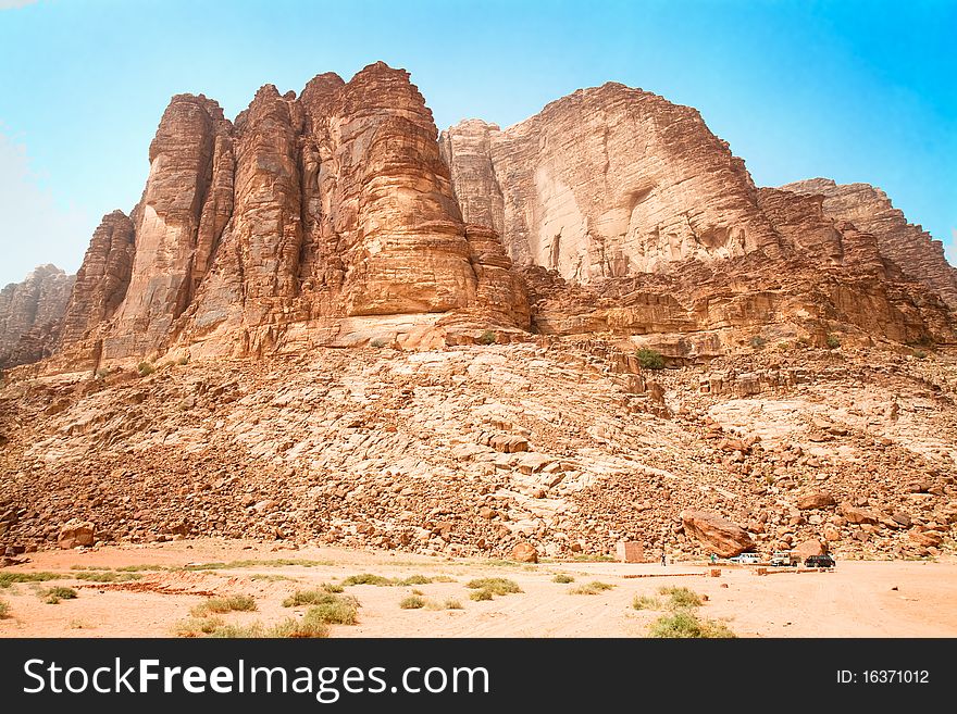 Rock hills above the famous Lawrence Spring, named after Lawrence of Arabia, Wadi Rum, UNESCO World Heritage Site in Jordan. Rock hills above the famous Lawrence Spring, named after Lawrence of Arabia, Wadi Rum, UNESCO World Heritage Site in Jordan.