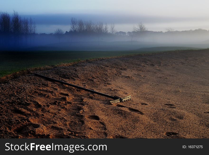 On a misty north england morning this glf course bunker was lit by the rising sun. On a misty north england morning this glf course bunker was lit by the rising sun