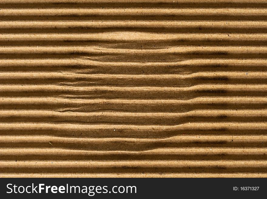 Brown corrugated cardboard texture, striped horizontally paper