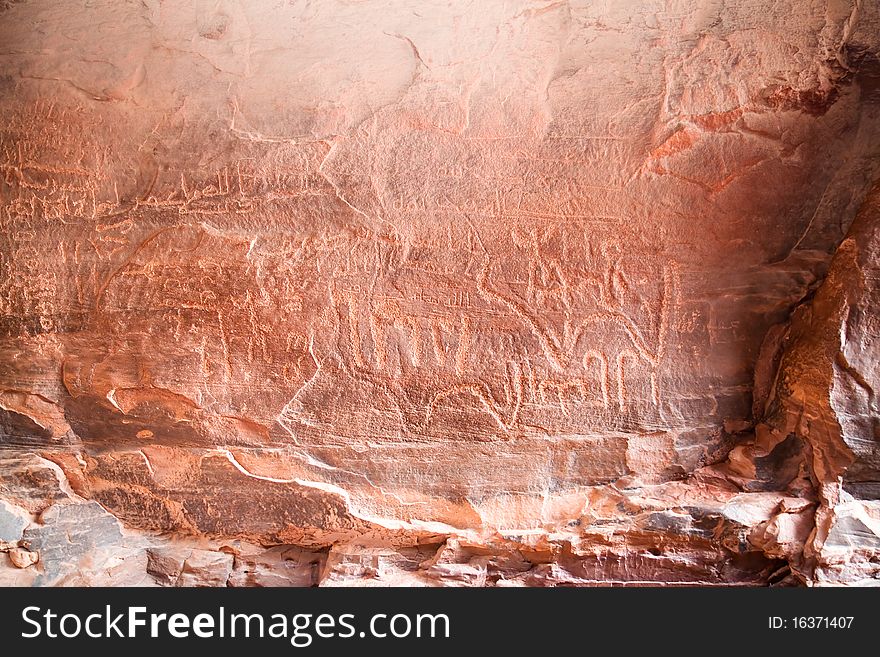 Ancient nabataean rock inscription in Khazali Canyon, early arabic scripture. Wadi Rum, Jordan