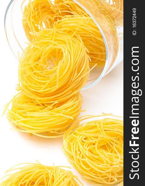 Pasta in glass jar on a white background