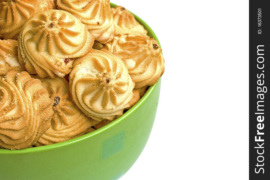 Bowl with cookies isolated over white background