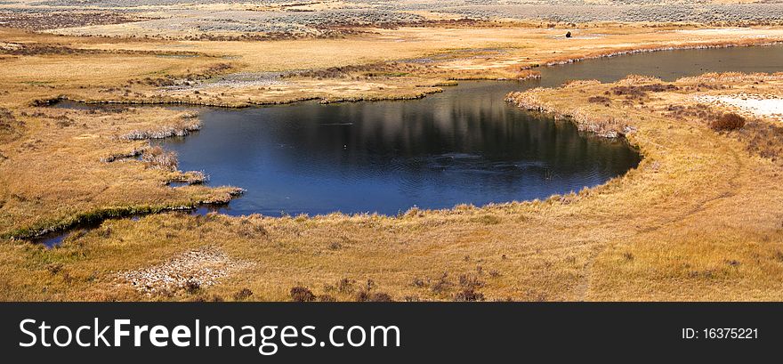 Panoramic view of hot spring pond in yellowstone national park