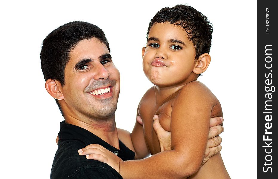 A happy young father carrying his son making a funny face on a white background. A happy young father carrying his son making a funny face on a white background