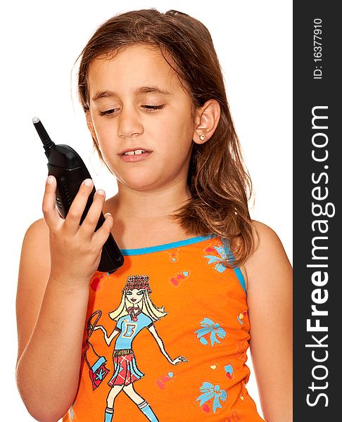 Beautiful girl looking angrily at a phone on a white background