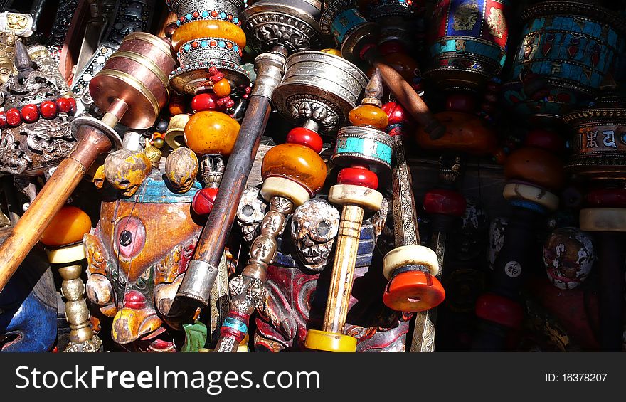 Tibetan prayer wheels and jewelry at a market in Lhasa,Tibet. Tibetan prayer wheels and jewelry at a market in Lhasa,Tibet.