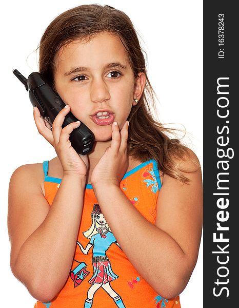 Beautiful girl with a happy expression talking on the phone on a white background. Beautiful girl with a happy expression talking on the phone on a white background