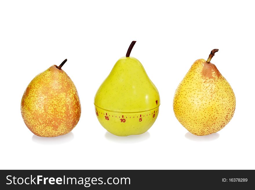 Two ripe fresh pears and green plastic pear timer