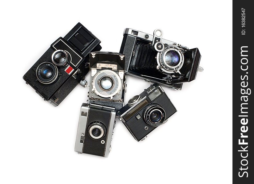 Many ancient cameras on white background